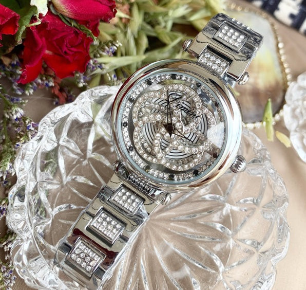 Foreign trade hot style watch female steel watch lady quartz watch to turn the windmill surface douyin the same Dujana147