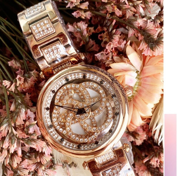 Foreign trade hot style watch female steel watch lady quartz watch to turn the windmill surface douyin the same Dujana147