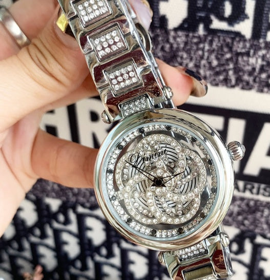 Foreign trade hot style watch female steel watch lady quartz watch to turn the windmill surface douyin the same Dujana147
