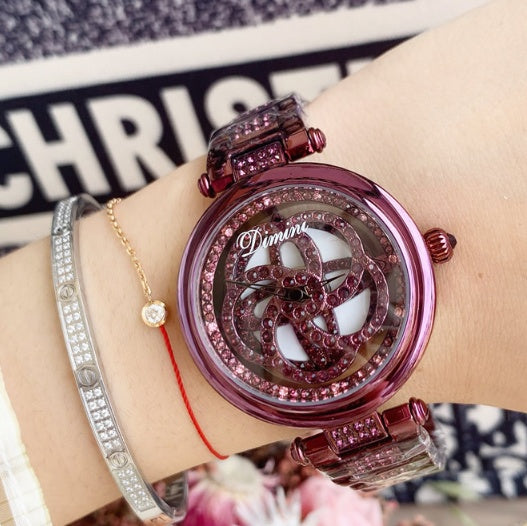 Foreign trade hot style watch female steel watch lady quartz watch to turn the windmill surface douyin the same Dujana147